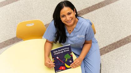 photo of student with childrens book
