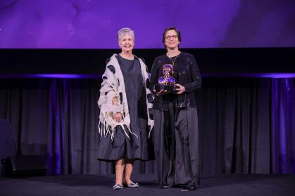 Dean Feldman receiving her award