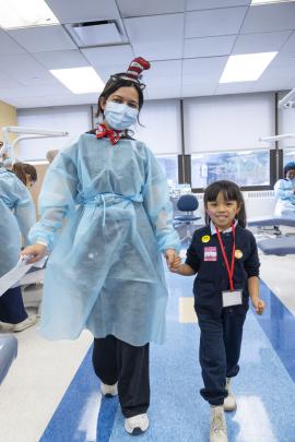 Dental student walking a patient 